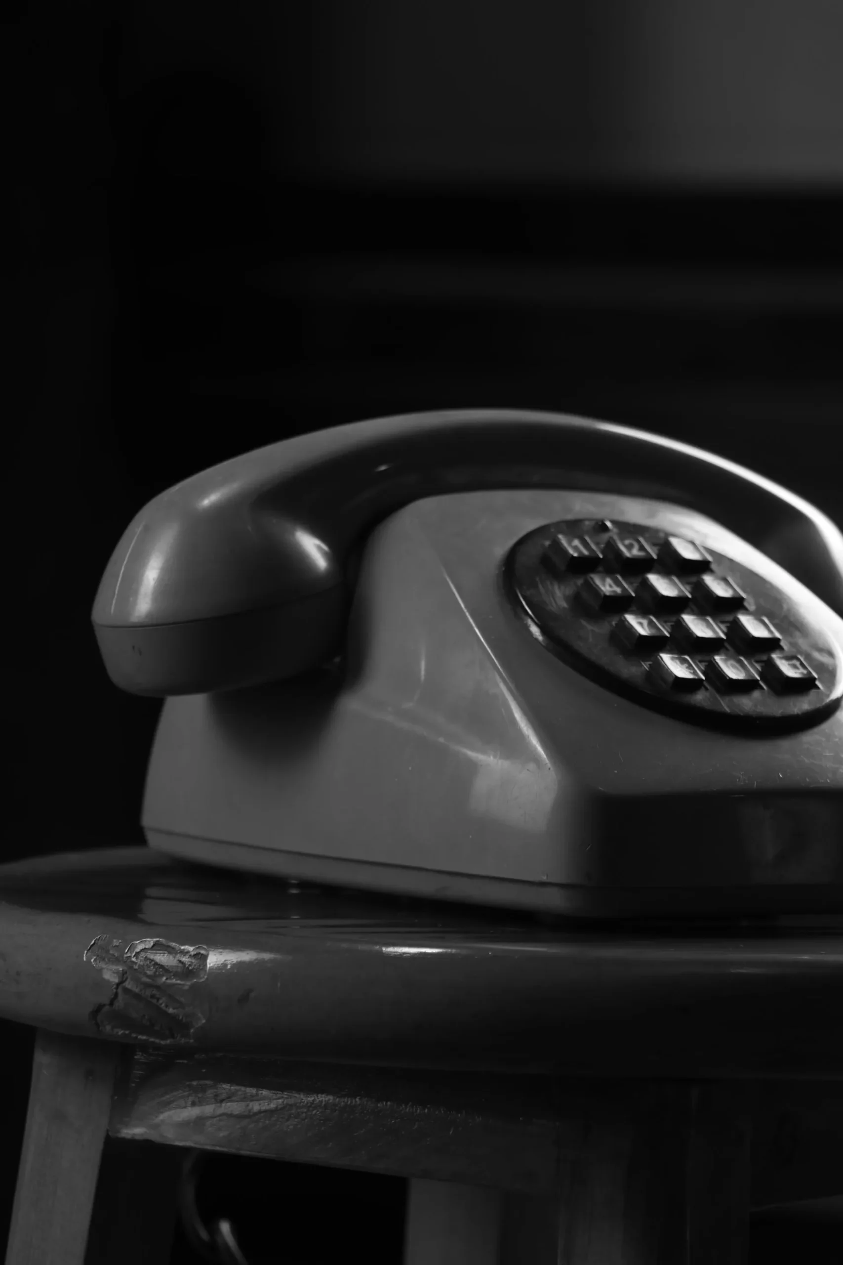 Photo by sulliwx: https://www.pexels.com/photo/vintage-rotary-telephone-in-black-and-white-29738110/